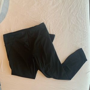 Cropped Fabletics leggings. Cutouts along sides. Side pockets.